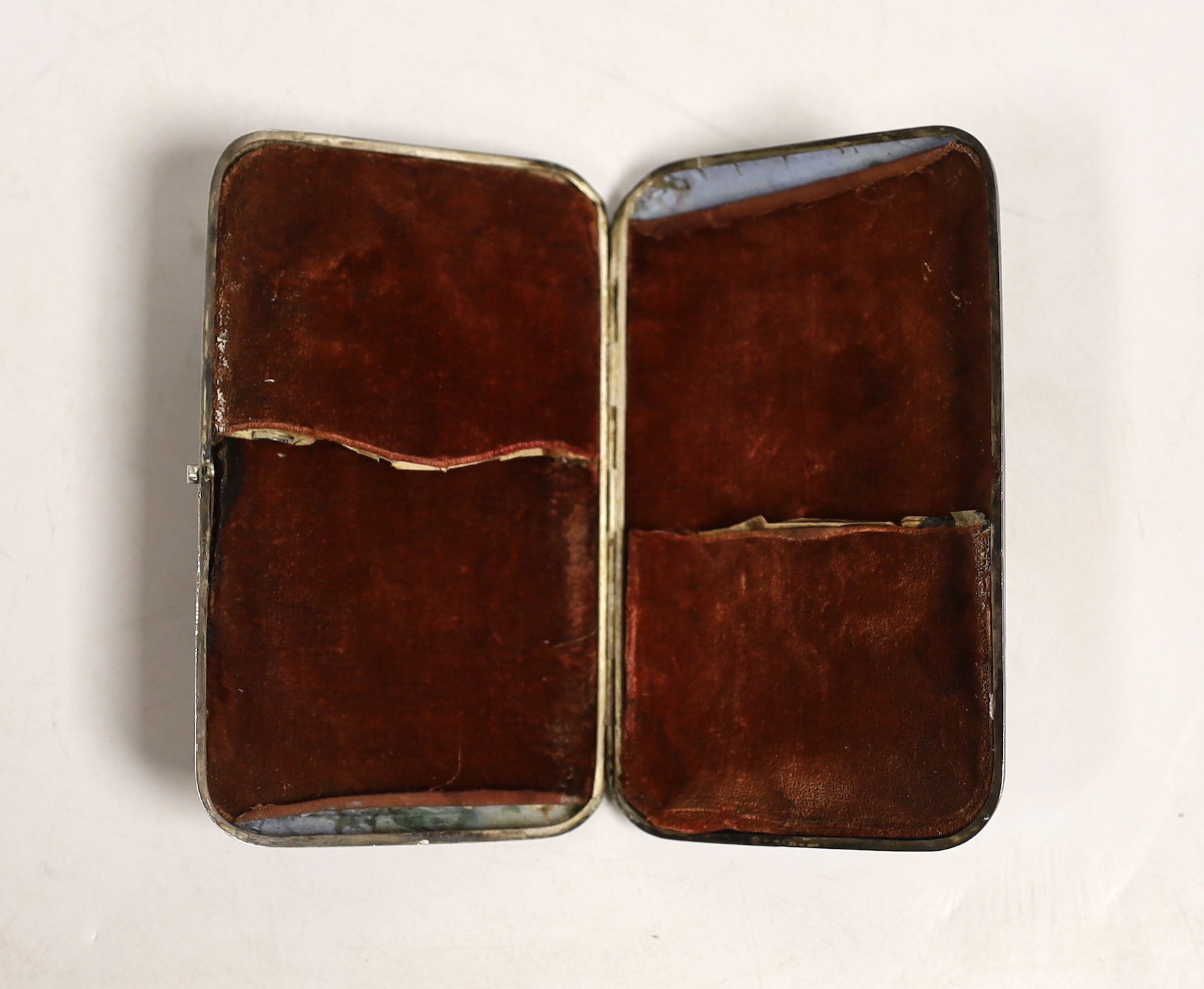 An Indian? white metal cigar case, decorated with figures at various pursuits in relief, 13.5cm, gross weight 309 grams.
